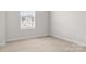This simple, carpeted bedroom features a window at 228 Brownstone Dr, Rock Hill, SC 29730