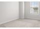 This simple bedroom features carpeted floors and a window at 228 Brownstone Dr, Rock Hill, SC 29730