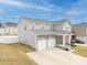 Aerial view of a charming two-story home with well-maintained lawn and a two-car garage at 228 Brownstone Dr, Rock Hill, SC 29730