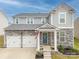 Charming two-story home with stone accents, a two-car garage, and a welcoming front porch at 228 Brownstone Dr, Rock Hill, SC 29730