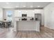 Bright, open-concept kitchen with white cabinets, a center island, and stainless steel appliances at 228 Brownstone Dr, Rock Hill, SC 29730