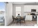 Eat-in kitchen with stainless appliances, bright light, and seating for four at 228 Brownstone Dr, Rock Hill, SC 29730