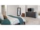 Bright main bedroom features carpeted floors, a mirror and a dresser with TV at 228 Brownstone Dr, Rock Hill, SC 29730