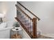 Staircase with dark wood banister and wrought iron spindles at 228 Brownstone Dr, Rock Hill, SC 29730