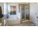 Modern bathroom features a soaking tub, glass shower, and granite countertops at 228 Mountain Island Dr # 38, Statesville, NC 28677