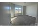 Bright bedroom with a large window and neutral carpet at 228 Mountain Island Dr # 38, Statesville, NC 28677