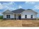 Charming single-story home with white siding and a well-manicured lawn at 228 Mountain Island Dr # 38, Statesville, NC 28677