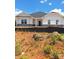 New construction single-story home featuring a gray and white exterior and a dark gray roof at 228 Mountain Island Dr # 38, Statesville, NC 28677