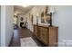 Inviting hallway featuring hardwood floors, decorative accents, and a view into the living room with fireplace at 228 Mountain Island Dr # 38, Statesville, NC 28677