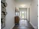 Bright hallway featuring hard floors, a console table, decor, and a glass-paneled front door at 228 Mountain Island Dr # 38, Statesville, NC 28677