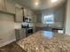 Modern kitchen features granite counters, stainless steel appliances, and gray cabinets at 228 Mountain Island Dr # 38, Statesville, NC 28677