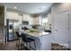 Modern kitchen with stainless steel appliances, granite countertops, and white cabinets, blending style and functionality at 228 Mountain Island Dr # 38, Statesville, NC 28677