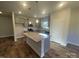 Open kitchen showcases granite counters, a center island, stainless appliances, and modern cabinets at 228 Mountain Island Dr # 38, Statesville, NC 28677