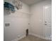 Functional laundry room with a utility sink hookups, shelving and neutral finishes at 228 Mountain Island Dr # 38, Statesville, NC 28677