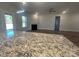 View of the naturally lit living room featuring hardwood floors, fireplace, and white trim at 228 Mountain Island Dr # 38, Statesville, NC 28677