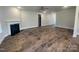 The spacious living room features hardwood floors, a fireplace, and plenty of natural light at 228 Mountain Island Dr # 38, Statesville, NC 28677