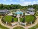 An aerial view of the neighborhood pool area, lush landscaping, and well-maintained amenities at 2311 Lochview St, Pineville, NC 28134