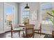Bright dining area featuring a round table, four chairs, a pendant light and a door to the outside at 2311 Lochview St, Pineville, NC 28134