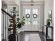 Elegant entryway with hardwood floors, stylish decor, and lots of natural light at 2311 Lochview St, Pineville, NC 28134