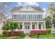 Stately home with inviting porch, detailed columns, and well-manicured landscaping at 2311 Lochview St, Pineville, NC 28134