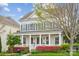 Charming home with inviting front porch, columns, and beautiful landscaping at 2311 Lochview St, Pineville, NC 28134