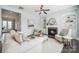 Comfortable living room with fireplace, built-in shelving, and lots of natural light at 2311 Lochview St, Pineville, NC 28134
