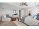 Spacious main bedroom with seating area, tray ceiling, and en-suite bathroom access at 2311 Lochview St, Pineville, NC 28134