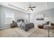 Serene main bedroom with tray ceiling, natural light, and neutral color palette at 2311 Lochview St, Pineville, NC 28134