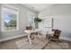Comfortable office with natural light, a desk, chair, and decorative rug at 2311 Lochview St, Pineville, NC 28134