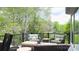 Deck features outdoor seating and views of the lush green trees at 2500 Giverny Dr, Charlotte, NC 28226