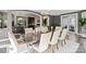 Elegant dining room features hardwood floors, a stylish table, and abundant natural light at 2500 Giverny Dr, Charlotte, NC 28226