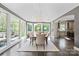 Bright dining room with large windows, hardwood floors, and stylish light fixture at 2500 Giverny Dr, Charlotte, NC 28226