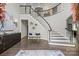 Grand foyer showcases a curved staircase with black railings and hardwood floors at 2500 Giverny Dr, Charlotte, NC 28226