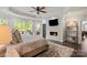 This bright main bedroom features trey ceilings and a fireplace for cooler evenings at 2500 Giverny Dr, Charlotte, NC 28226