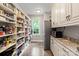 Walk-in pantry with ample storage, shelving, and a well-organized layout with natural light at 2500 Giverny Dr, Charlotte, NC 28226