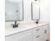 Modern bathroom featuring double sinks, matte black hardware, and a walk-in shower at 2501 Elon St, Charlotte, NC 28208