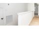 Well-lit hallway featuring pristine white trim, a light-colored wood floor, and access to other rooms at 2501 Elon St, Charlotte, NC 28208
