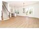 Bright living room featuring an open floor plan, natural light, and hardwood floors at 2501 Elon St, Charlotte, NC 28208