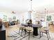 A stylish, virtually staged living and dining area flowing into the kitchen for modern living at 2501 Elon St, Charlotte, NC 28208