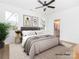 Bright main bedroom with large windows, neutral décor, and ensuite access at 2501 Elon St, Charlotte, NC 28208
