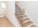 Bright staircase with wooden steps and modern black railing at 2501 Elon St, Charlotte, NC 28208