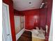 Red bathroom featuring a vanity, toilet, and shower at 2527 Carya Pond Ln, Charlotte, NC 28212