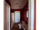Red bathroom featuring a vanity, toilet, shower, and tub at 2527 Carya Pond Ln, Charlotte, NC 28212