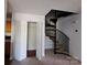 Living room with stairs and closet at 2527 Carya Pond Ln, Charlotte, NC 28212