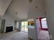 Spacious living room featuring a fireplace, built-in shelving, and sliding glass doors to a deck at 2527 Carya Pond Ln, Charlotte, NC 28212