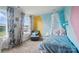 Comfortable bedroom featuring a plush bed, charming decor, and an accent wall at 2533 Ensemble Ct, Charlotte, NC 28262