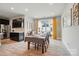 Open concept dining room with wood floors, stylish decor, and sliding glass doors for seamless indoor-outdoor living at 2533 Ensemble Ct, Charlotte, NC 28262