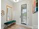 Bright entryway with a stylish bench, mirror, and natural light at 2533 Ensemble Ct, Charlotte, NC 28262