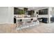 Modern kitchen featuring dark cabinets, an island with bar stools, and stainless steel appliances for culinary enthusiasts at 2533 Ensemble Ct, Charlotte, NC 28262