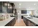 Open kitchen with sleek countertops, stainless steel appliances, and a view into the dining area, perfect for modern living at 2533 Ensemble Ct, Charlotte, NC 28262